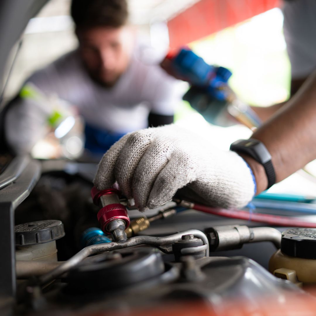 Technician inspecting a vehicle at On & Off Road Express in Slidell